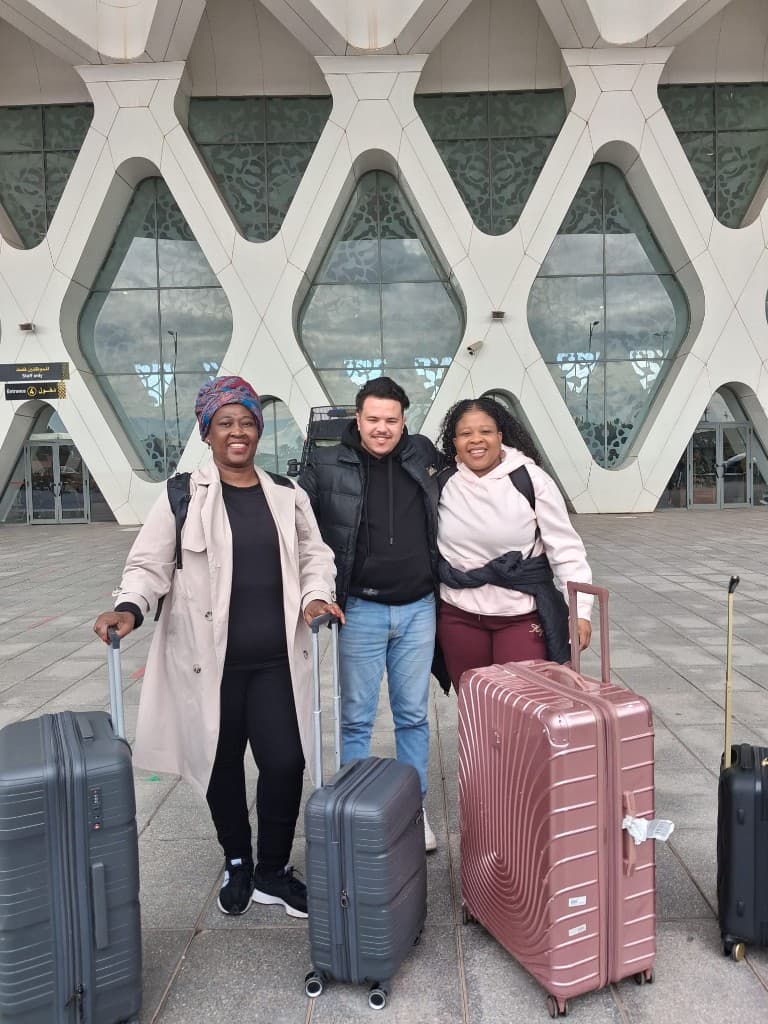 Adam City Tours guide welcoming clients at Marrakech Menara Airport