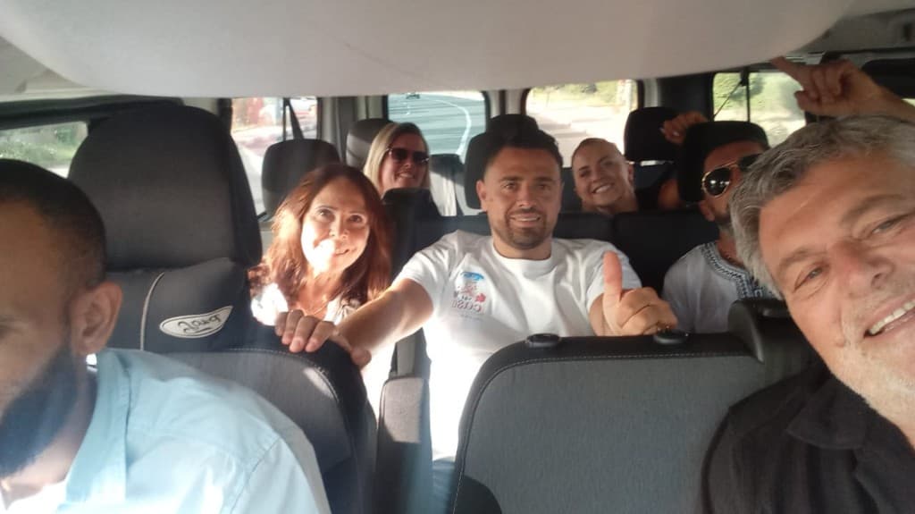 Adam City Tours clients enjoying a group transfer in the tour van across Morocco