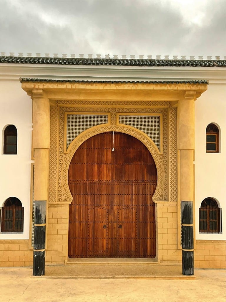 Traditional wooden gate and facade in Fes